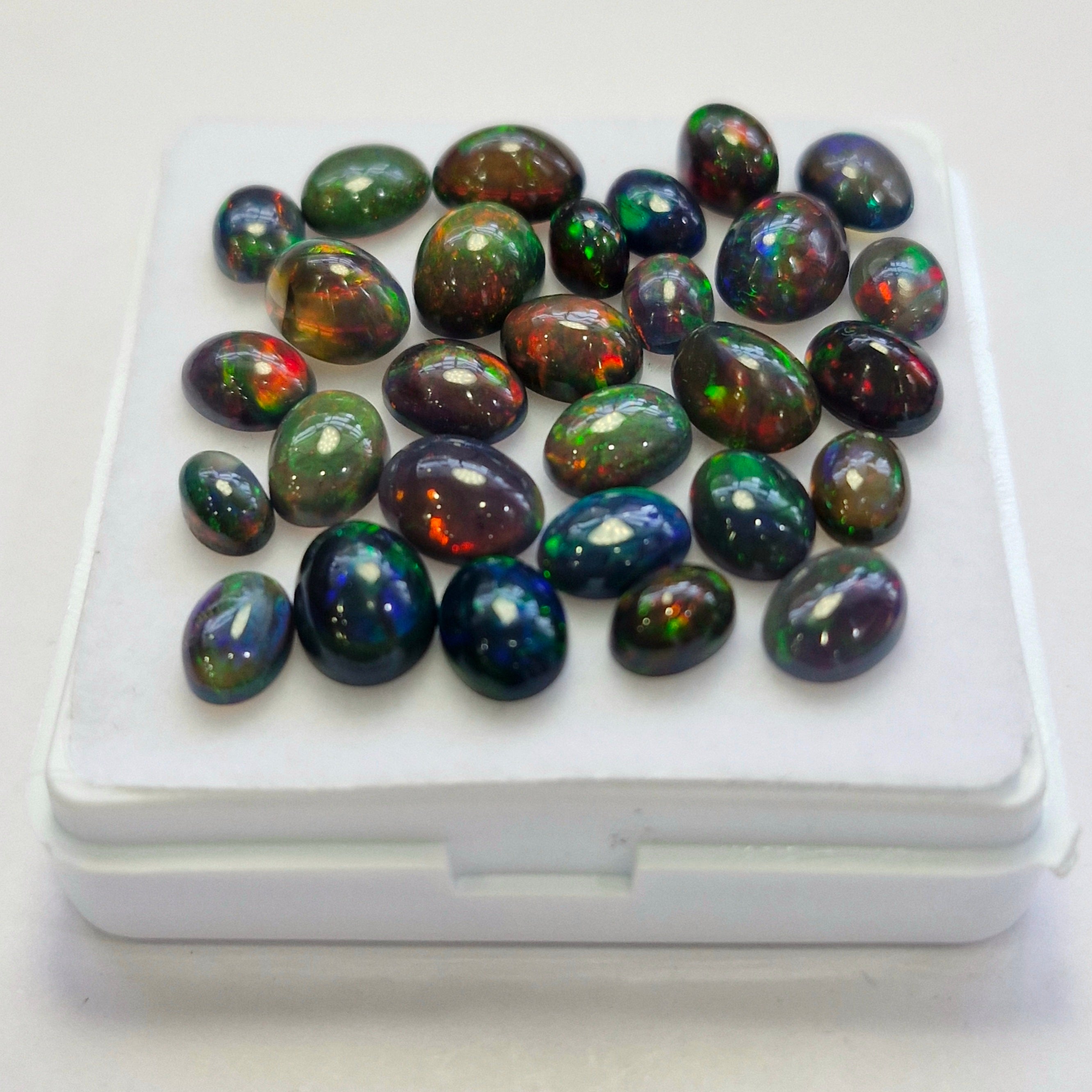 29 pcs of  Ethiopian Black Smoked Opal Oval Shape | 22.4Cts | 6mm to 9mm size