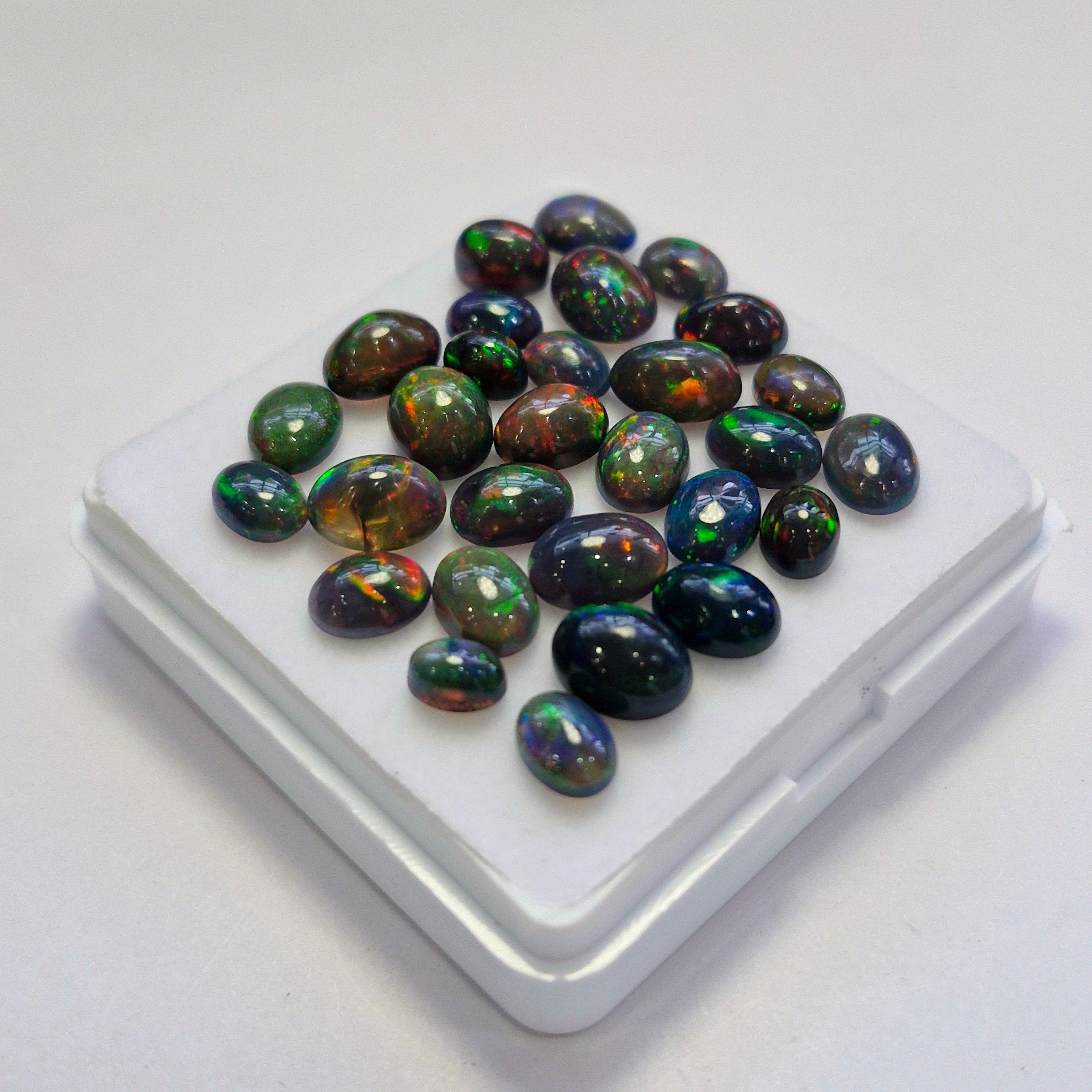29 pcs of  Ethiopian Black Smoked Opal Oval Shape | 22.4Cts | 6mm to 9mm size