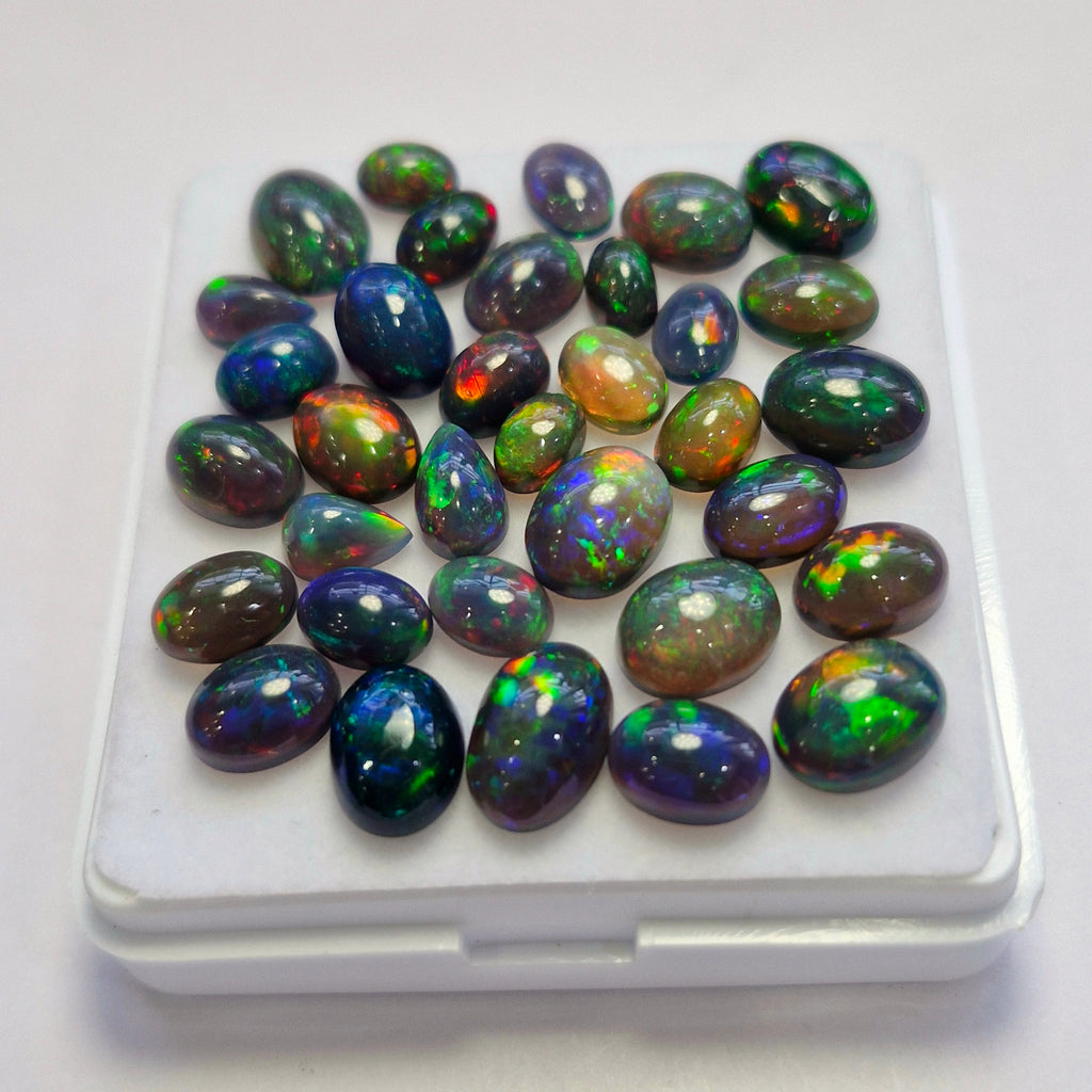 33 pcs of  Ethiopian Black Smoked Opal Mix Shape | 25.7Cts | 6mm to 10mm size
