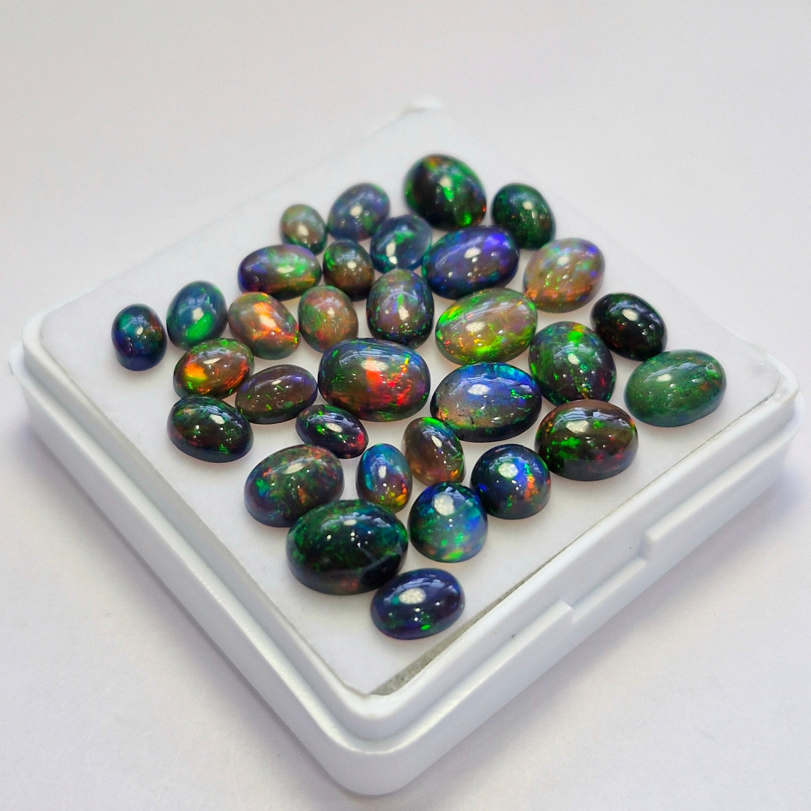 32 pcs of  Ethiopian Black Smoked Opal Mix Shape | 23.5Cts | 6mm to 9mm size