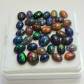 36 pcs of  Ethiopian Black Smoked Opal Oval Shape | 23.1Cts | 6mm to 9mm size
