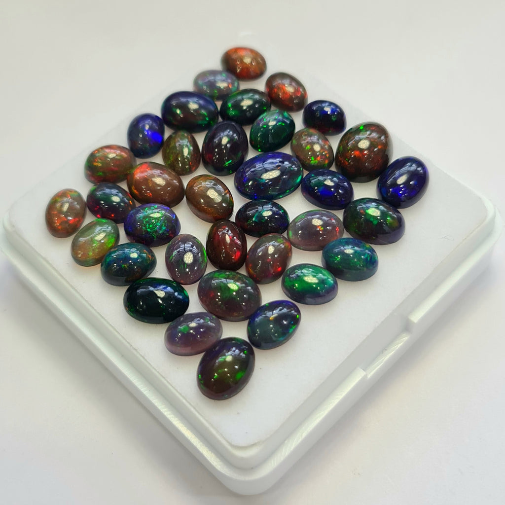 36 pcs of  Ethiopian Black Smoked Opal Oval Shape | 23.1Cts | 6mm to 9mm size