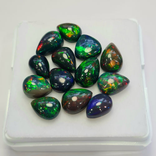 13 pcs of  Ethiopian Black Smoked Opal Pear Shape | 24.1Cts | 10mm to 12mm size