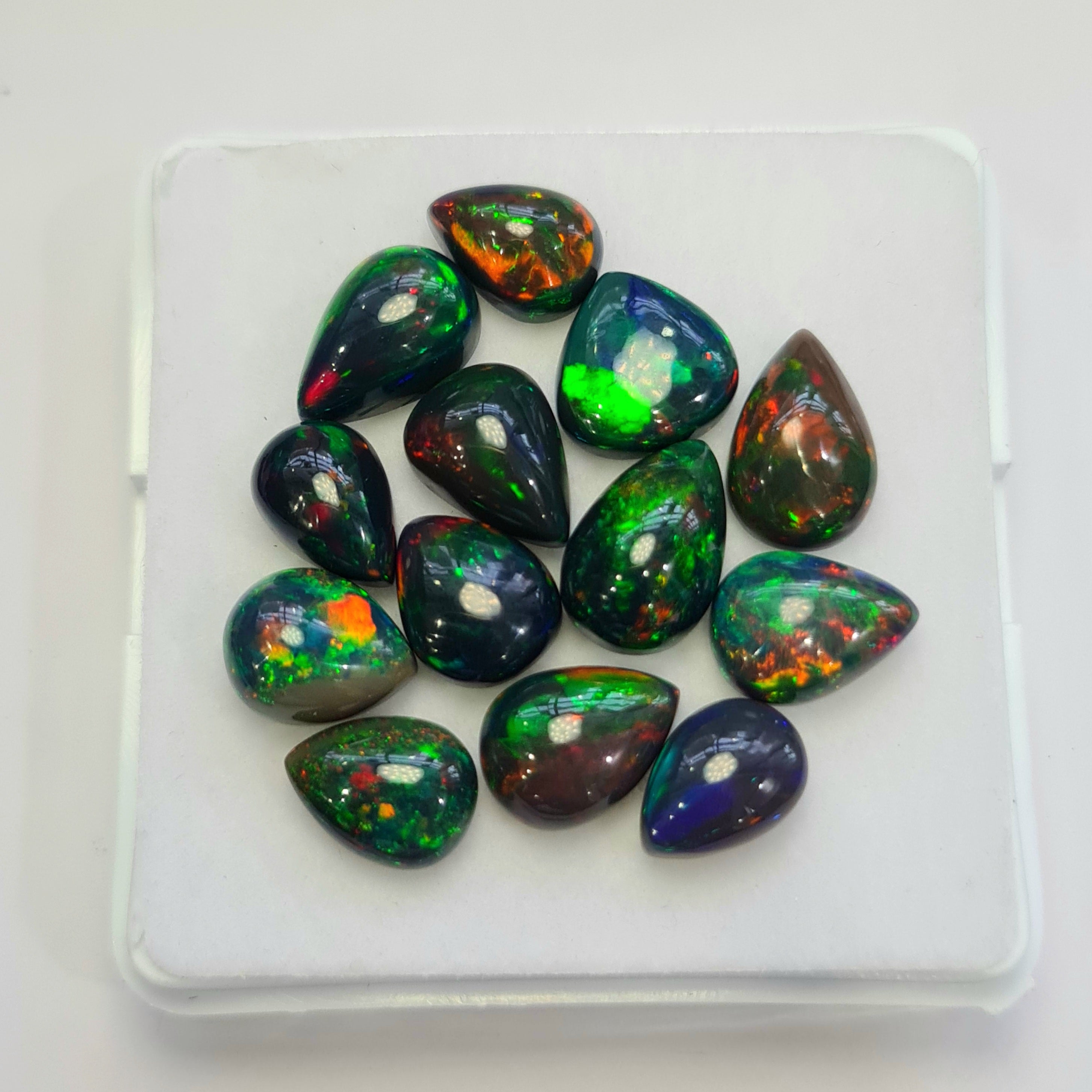 13 pcs of  Ethiopian Black Smoked Opal Pear Shape | 24.1Cts | 10mm to 12mm size