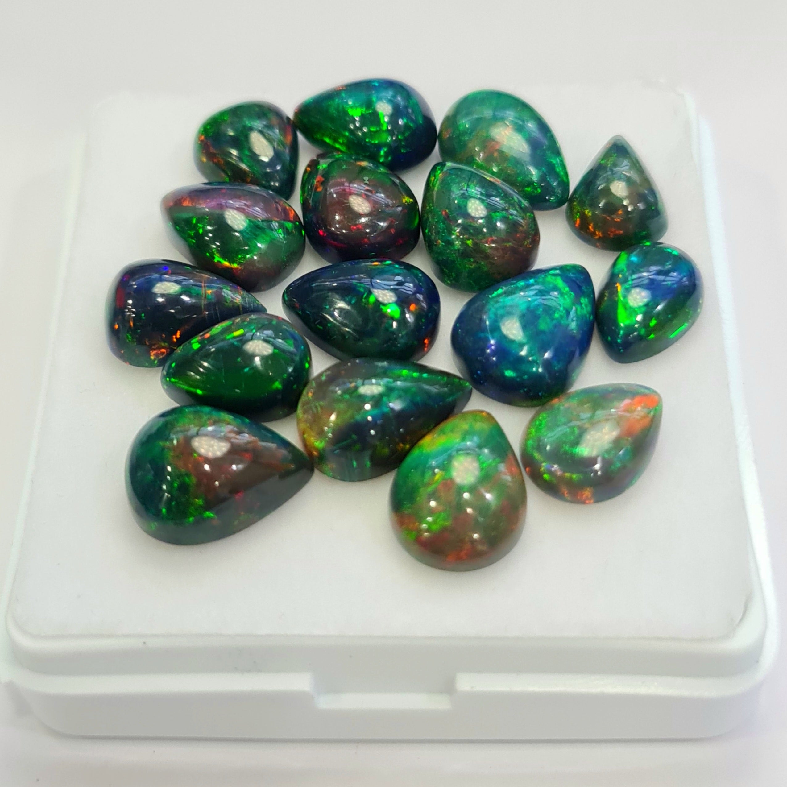 16 pcs of  Ethiopian Black Smoked Opal Pear Shape | 30.9Cts | 9mm to 12mm size
