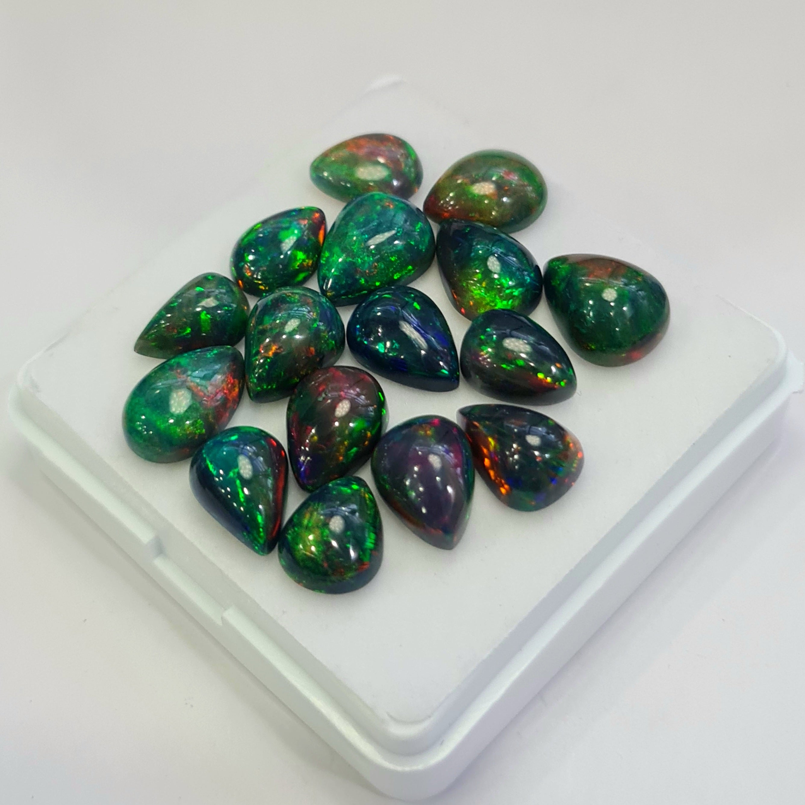 16 pcs of  Ethiopian Black Smoked Opal Pear Shape | 30.9Cts | 9mm to 12mm size