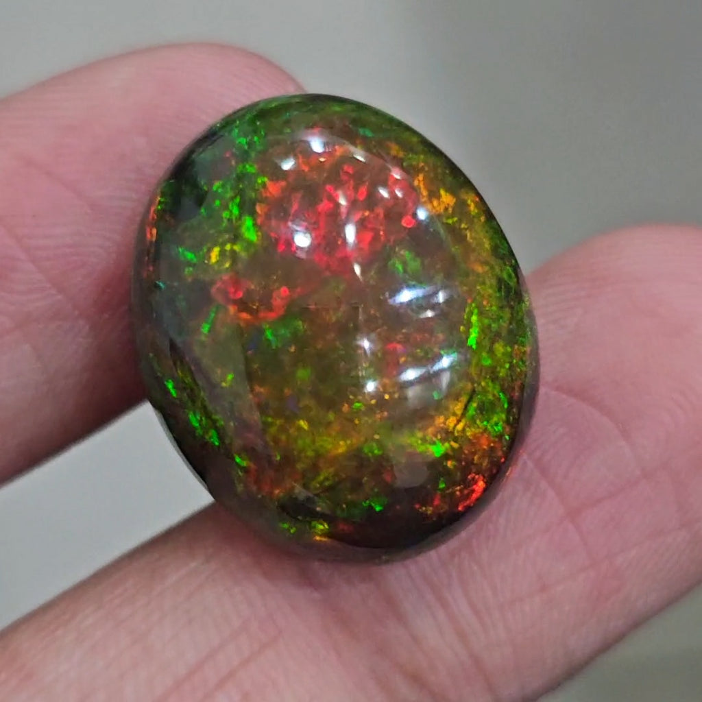 17.6Cts Natural Ethiopian Black Opal Cabochon | Oval | 22x18mm | Smoked
